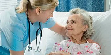 nurse helping patient